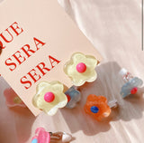 Sun clip flower earrings